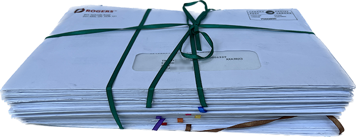 A tied stack of Rogers cable bills at the end of the project